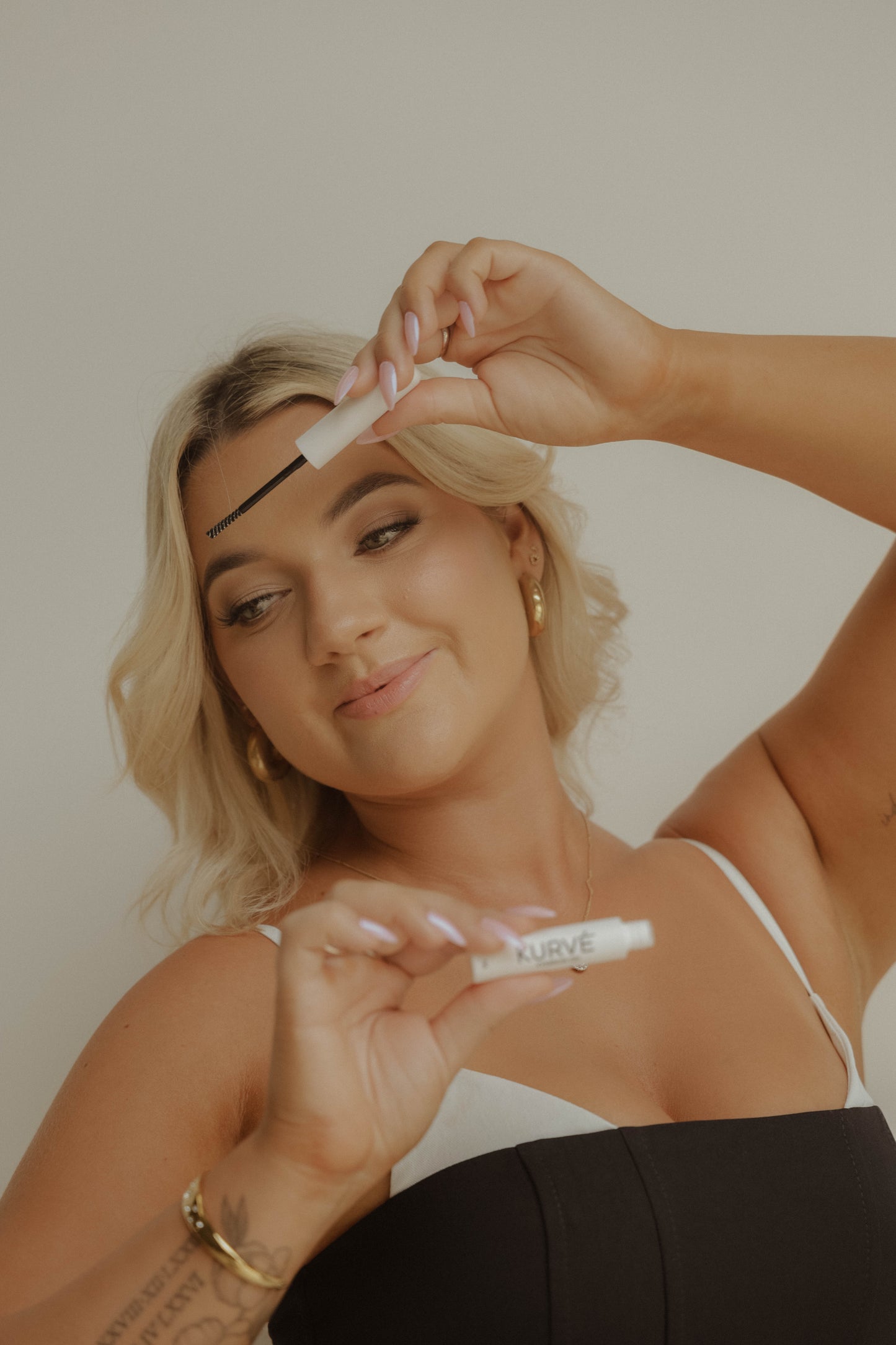 Woman applying eyebrow product 